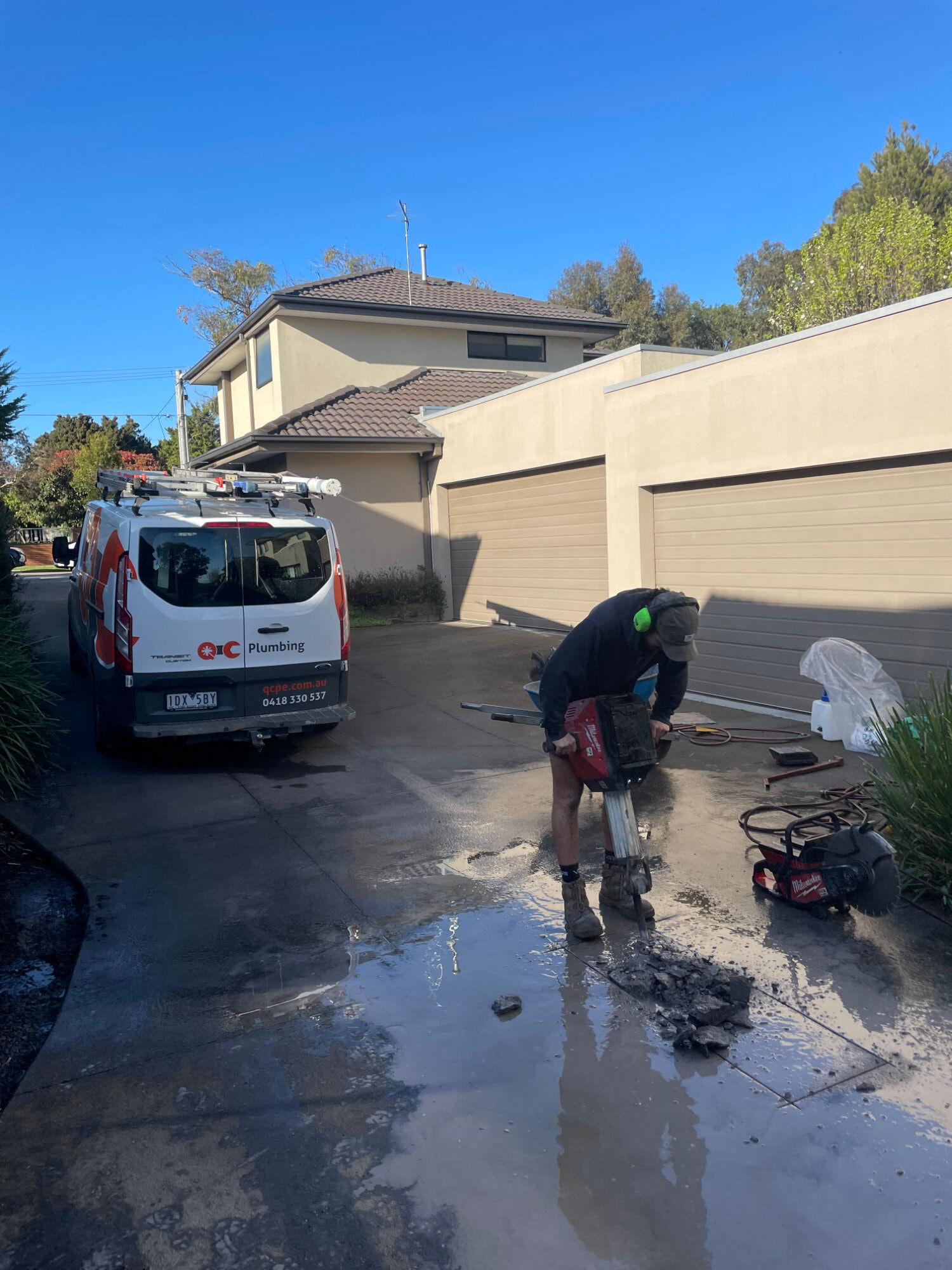 Breaking up concrete to replace burst pipe